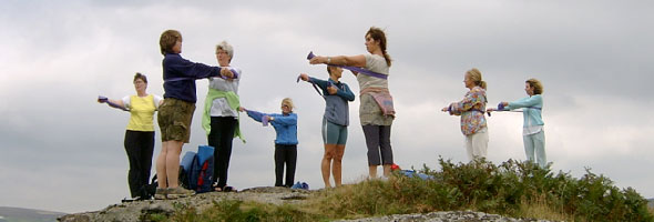 Picture of group performing exercises outdoors